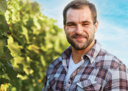 Man in plaid shirt smiling 