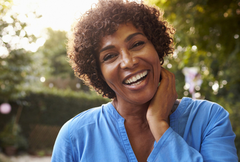 Woman in blue smiling 