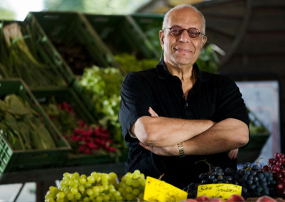 Smiling man with arms crossed 