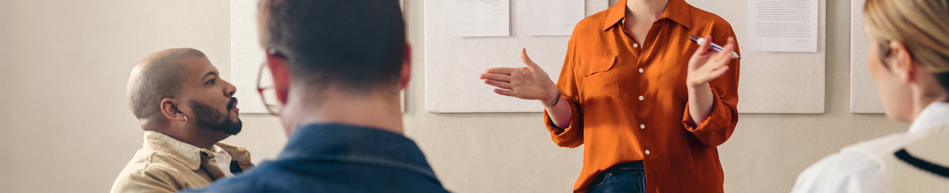 Woman presenting in front of a group 