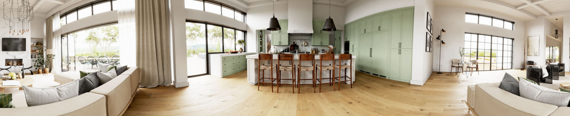 A panoramic view of a kitchen and lounging spaces.