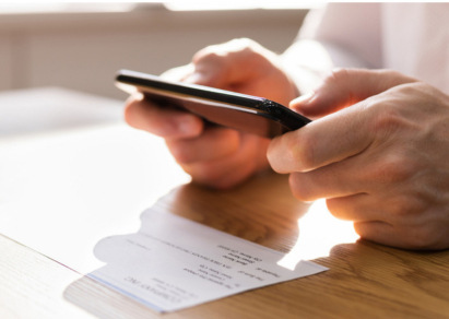 Person using phone for remote deposit 