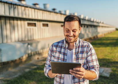 man using tablet smiling 