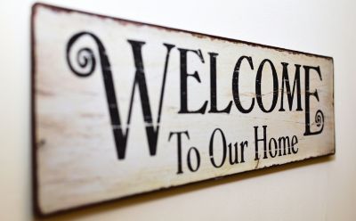 A sign that says "Welcome to Our Home". 