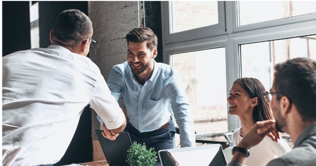 Shaking hands at a meeting 