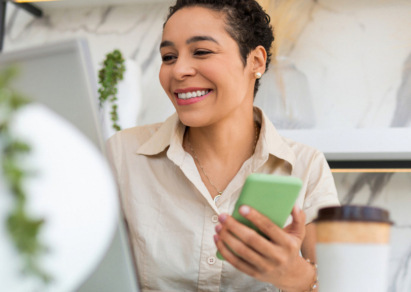 Woman holding a green smartphone 